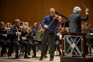 Atlanta Symphony Orchestra concertmaster David Coucheron performs Saint-Saëns’ Violin Concerto No. 3 with guest conductor Peter Oundjian. Photo by Dane Sponberg