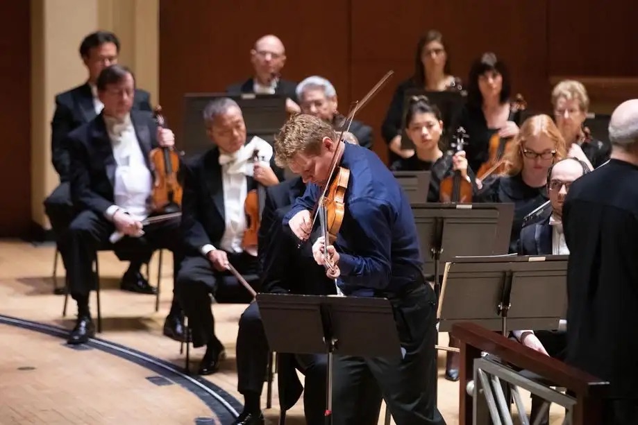 David plays violin with orchestra